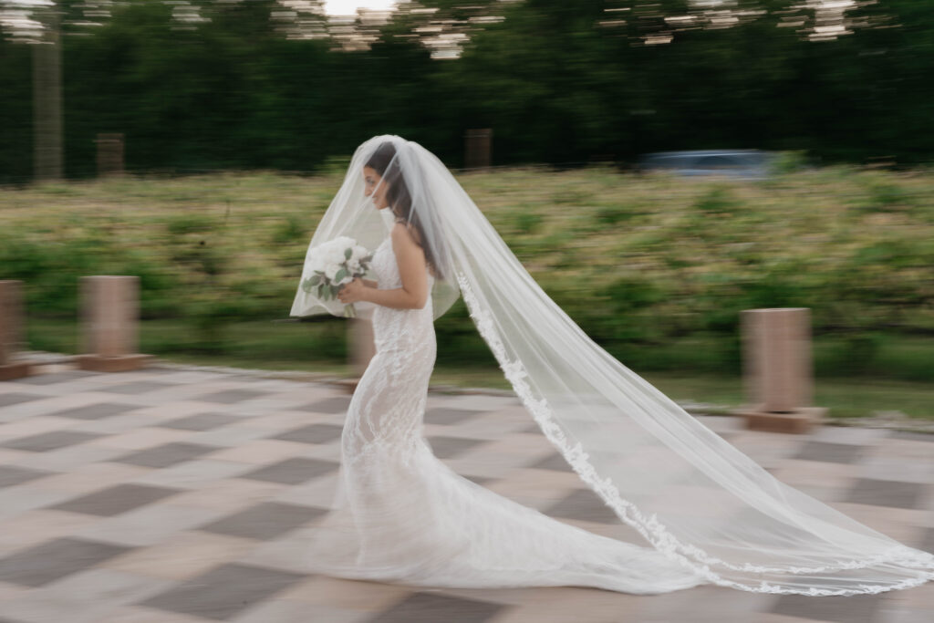 bride walking to her ceremony site at la bullerie