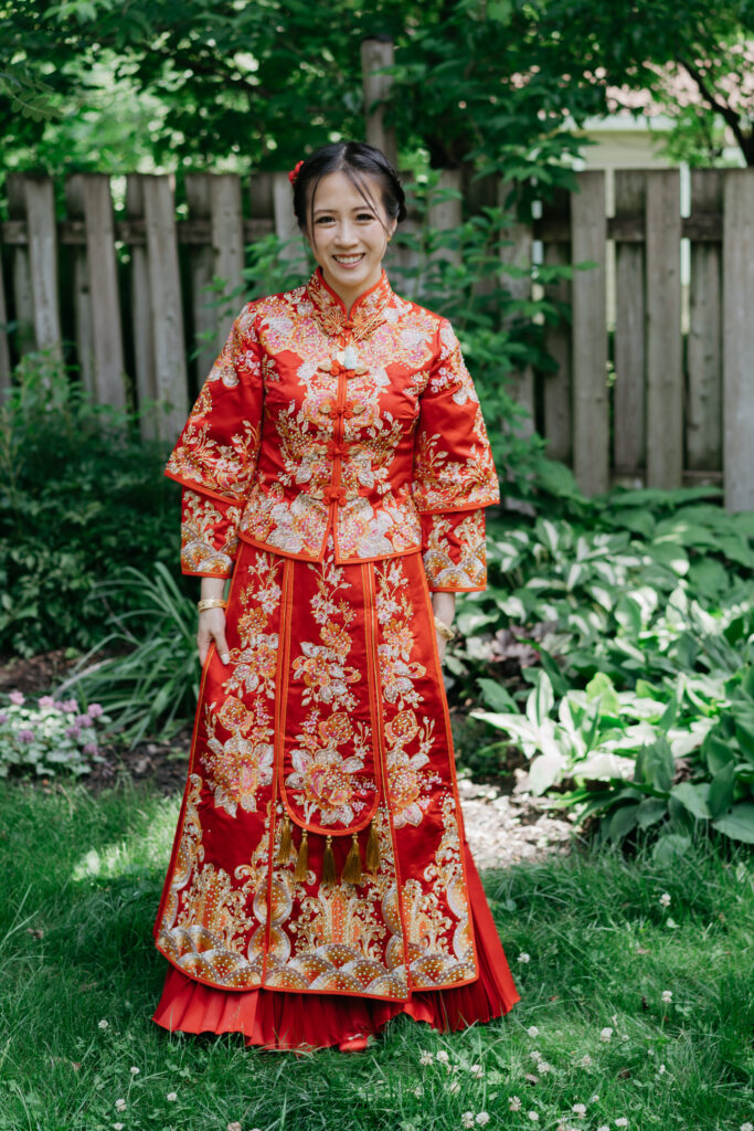 portrait of a chinese bride wearing a red Qun Kwa during a chinese wedding ceremony