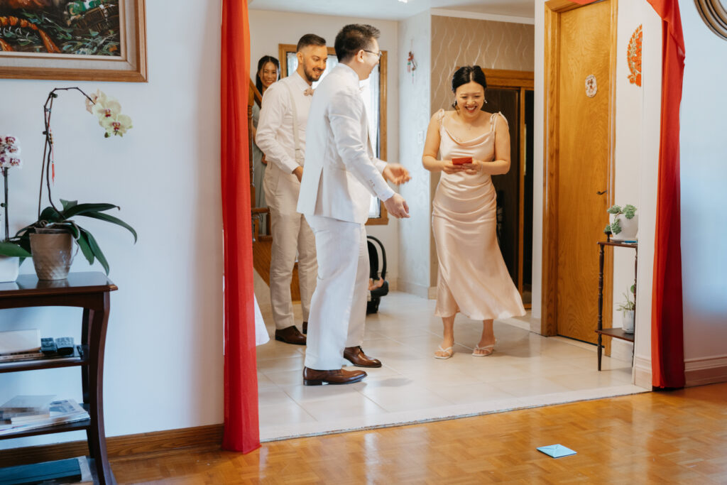 Groom's sister playing ddkaji game during a chinese wedding in Montreal