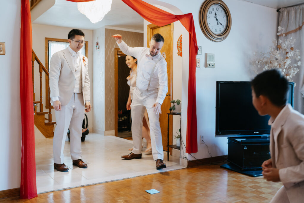 Groom's brother in law playing ddkaji game during a chinese wedding in Montreal
