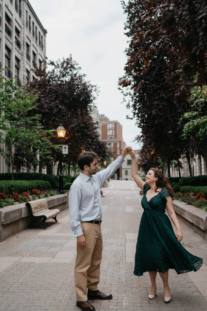 Majolica photo Couple dancing in the streets of the old port of montreal during their engagement session